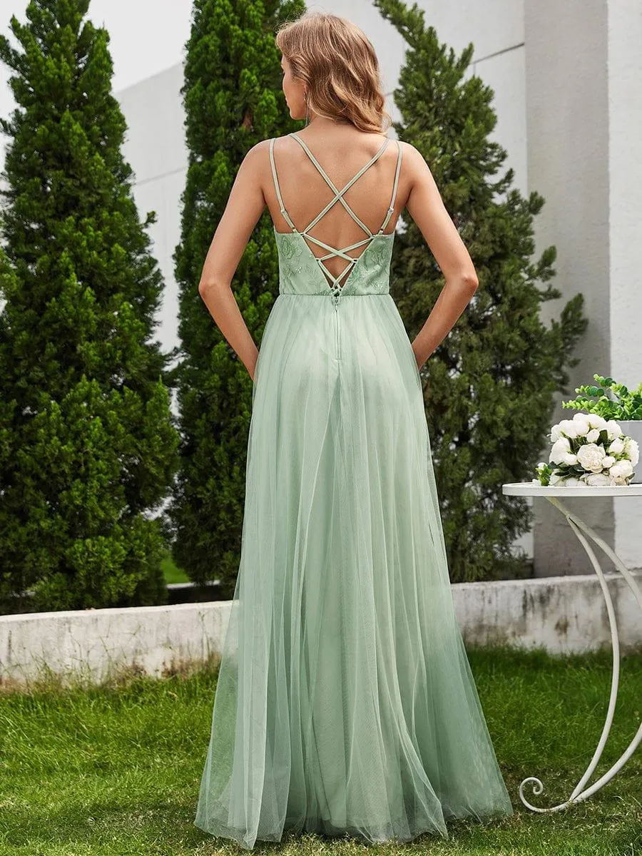 Robe de demoiselle d'honneur sans manches en tulle pailleté avec bretelles croisées dans le dos
