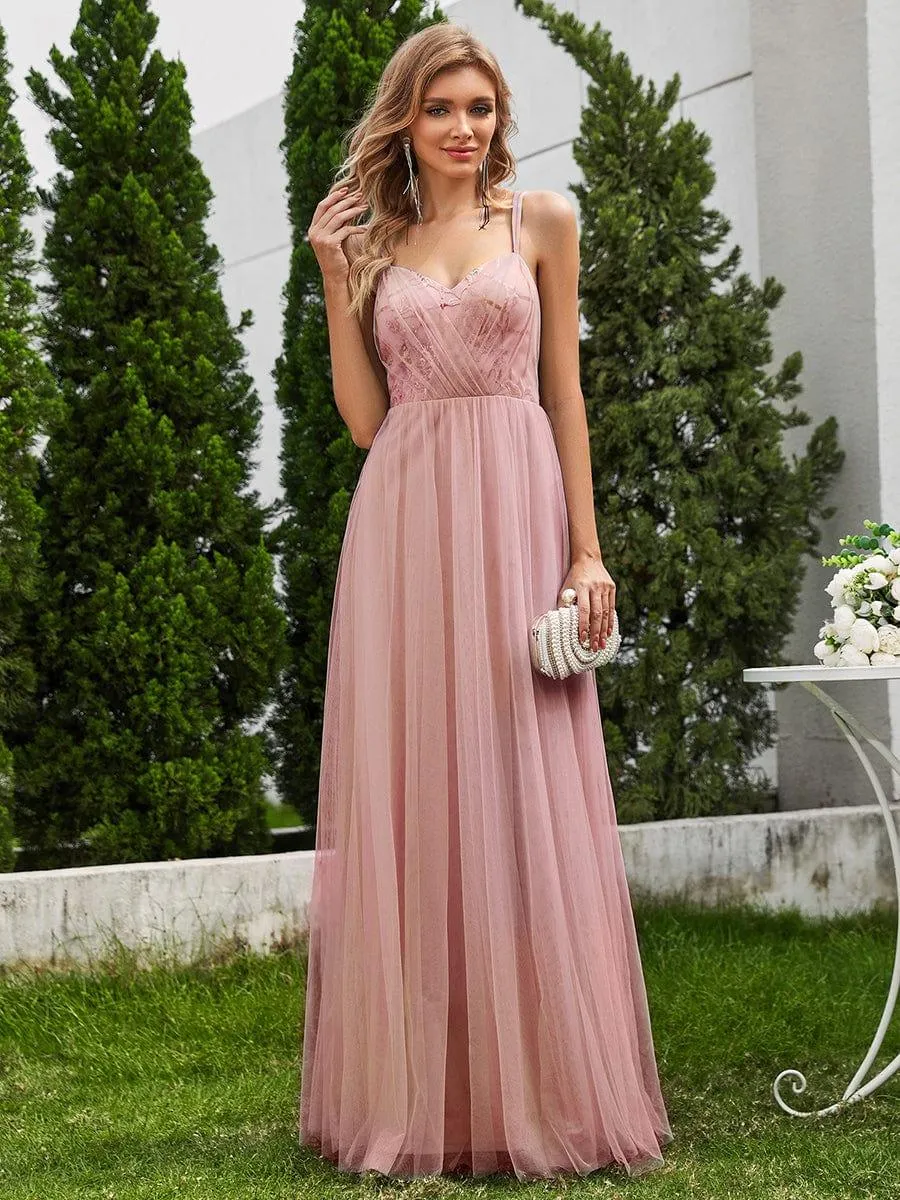 Robe de demoiselle d'honneur sans manches en tulle pailleté avec bretelles croisées dans le dos